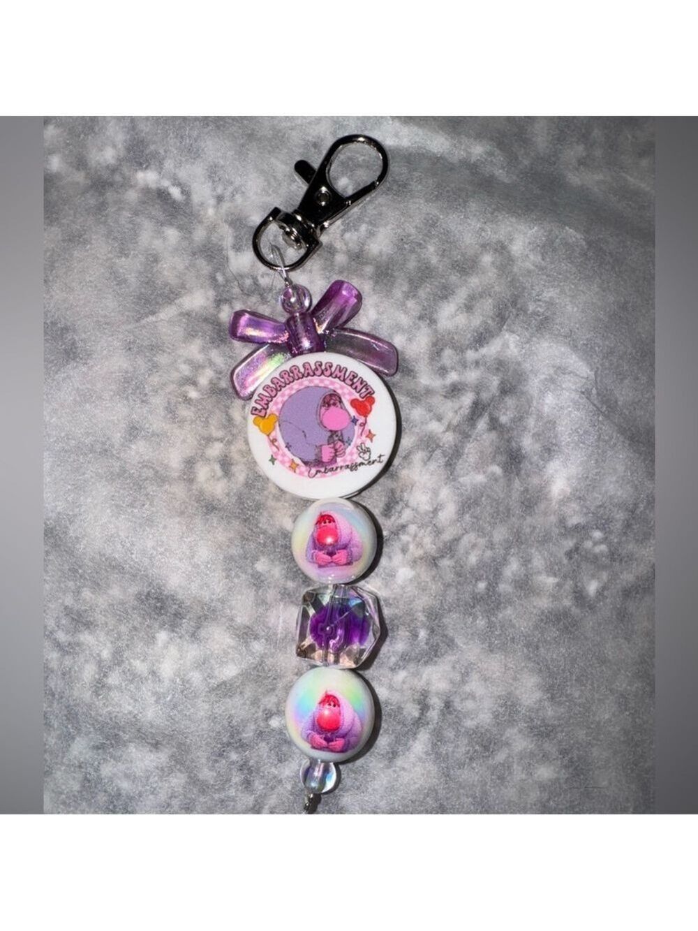 Purple and White Keychain with inside out Cartoon Design